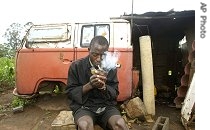 This man and his family live in  an abandoned van, after the Zimbabwean government demolished their home