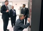 Deputy Secretary Sell signs the face of a Cray computer at Oak Ridge National Laboratory