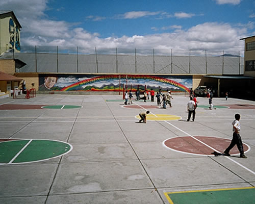 Children playing in schoolyard at La Tola School in Quito, Ecuador