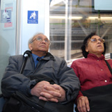 Two passengers using the priority seating