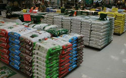 Photo of multiple stacks of fertilizer bags