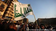 A member of the Ansar Allah (Partisans of God) Salafi group, known to have links with the al-Qaeda network, waves his movement's flag during a rally in Tahrir square PATRICK BAZ/AFP/GettyImages