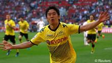 Borussia Dortmund's Shinji Kagawa celebrates a goal against Cologne during the German first division Bundesliga soccer match in Cologne March 25, 2012. (Photo: Reuters)
