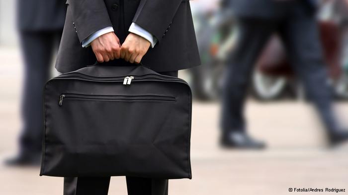 business man holding a briefcase (photo: Andres Rodriguez - Fotolia 2005)
