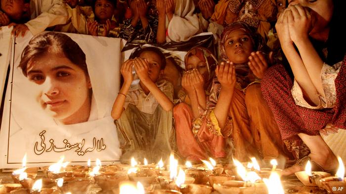 Pakistani children pray for Malala Yousafzai, who was shot on Tuesday by the Taliban
(Photo: Shakil Adil/ AP/ dapd)