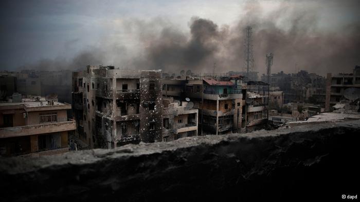 Smoke rises over Saif Al Dawla district in Aleppo, Syria, Tuesday, Oct. 2, 2012. The U.N.'s deputy secretary-general says U.N. chief Ban Ki-moon made a strong appeal to Syria's foreign minister to stop using heavy weapons against civilians and reduce the violence that is killing 100 to 200 people every day.(AP Photo/ Manu Brabo)