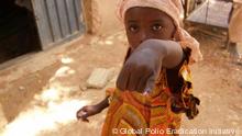 A child receiving a polio vaccination in Nigeria.