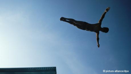 A man jumps from a diving board