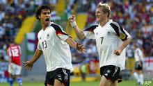 Germany's Michael Ballack, left, celebrates with teammate Bastian Schweinsteiger after scoring the opening goal during the Euro 2004 Group D soccer match between Germany and the Czech Republic at the Jose Alvalade Stadium in Lisbon, Portugal, Wednesday June 23, 2004. 