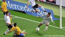 Germany's Miroslav Klose (L) slams the ball into the net