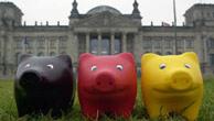 Three pigs painted in Germany's colors