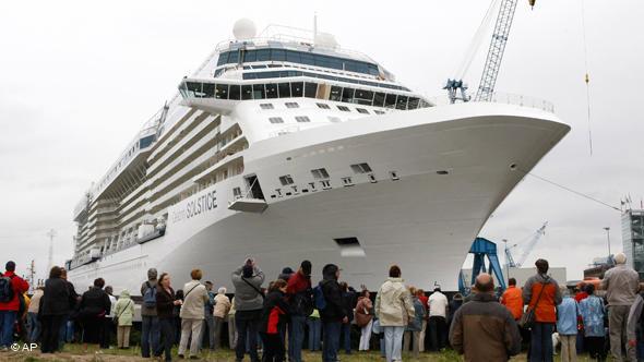 The new cruiser Celebrity Solstice is seen after it left the covered building dock of the shipyard Meyer in Papenburg, Germany, on Sunday, Aug. 10, 2008. It is 315 meters long and 36,8 meters wide with 1,426 cabins for 2,852 passengers. The Solstice of the U.S. shipping company Celebrity is the largest cruiser ever built in Germany. (AP Photo/Joerg Sarbach)
