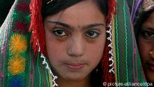 A twelve year old Afghan bride during the wedding ceremony in Herat on Sunday 25 December 2005. The vast majority of Afghanistan's population professes to be followers of Islam. Over 1400 years ago, Islam demanded that men and women be equal before God, and gave them various rights such the right to inheritance, the right to vote, the right to work, and even choose their own partners in marriage. For centuries now in Afghanistan, women have been denied these rights either by official government decree or by their own husbands, fathers, and brothers. In rural areas of the country women are not allowed to seek medical help from a male doctor. Afghanistan has the second highest maternal mortality rate in the world where poor health conditions and malnutrition made pregnancy and childbirth exceptionally dangerous for Afghan women. Foto: FARAHANAZ KARIMY +++(c) dpa - Report+++