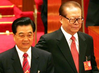 Chinese President Hu Jintao at left and former President Jiang Zemin arrive for the opening ceremony of the 17th Communist Party Congress held at the Great Hall of the People in Beijing Monday, Oct. 15, 2007. The congress, held once every five years, is a crucial test of strength for president and party leader Hu, who is expected to open the meeting with a speech laying out the policy agenda for what is expected to be his final five years in power. (AP Photo/Greg Baker) 