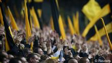 Supporters of Borussia Dortmund celebrate during their first division Bundesliga soccer match against SC Freiburg in Dortmund, May 5, 2012. (Reuters)