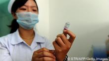 A Chinese nurse prepares a dose of vaccination against measles as part of a free 10-day nationwide campaign to urge parents to participate amid public fears about the safety of the inoculations in Hefei, in eastern China's Anhui province on September 11, 2010. China launched a measles vaccination programme targeting 100 million children in a bid to eradicate the disease, a leading cause of avoidable death in developing nations, by 2012. CHINA OUT AFP PHOTO (Photo credit should read STR/AFP/Getty Images) 