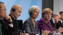 Christine Lagarde, diretora do FMI, e Angela Merkel, chanceler alemã, no encontro de organizações económico-financeiras mundiais em Berlim