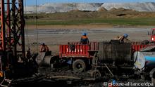 Mongolian miners working in Baganuur coal mine in Banganuur city, Mongolia
EPA/HOW HWEE YOUNG 