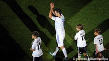 Michael Ballack with his three sons thanks the fans in the Red Bull Arena in Leipzig (Sachsen). Foto: Jan Woitas/dpa 